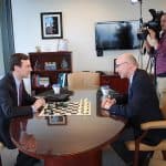 Attorney General Bob Ferguson plays a chess match with Q13 Fox News political analyst C.R. Douglas.