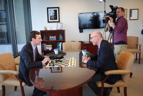 Attorney General Bob Ferguson plays a chess match with Q13 Fox News political analyst C.R. Douglas.