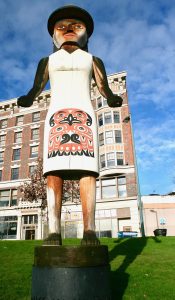 The welcome figure is a masterpiece of native woodcarving towering over Tollefson plaza