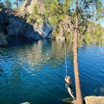 Swimmers can leap from a rope swing into The Cove at Fisk State Park.