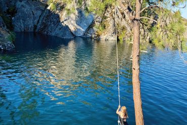 Swimmers can leap from a rope swing into The Cove at Fisk State Park.
