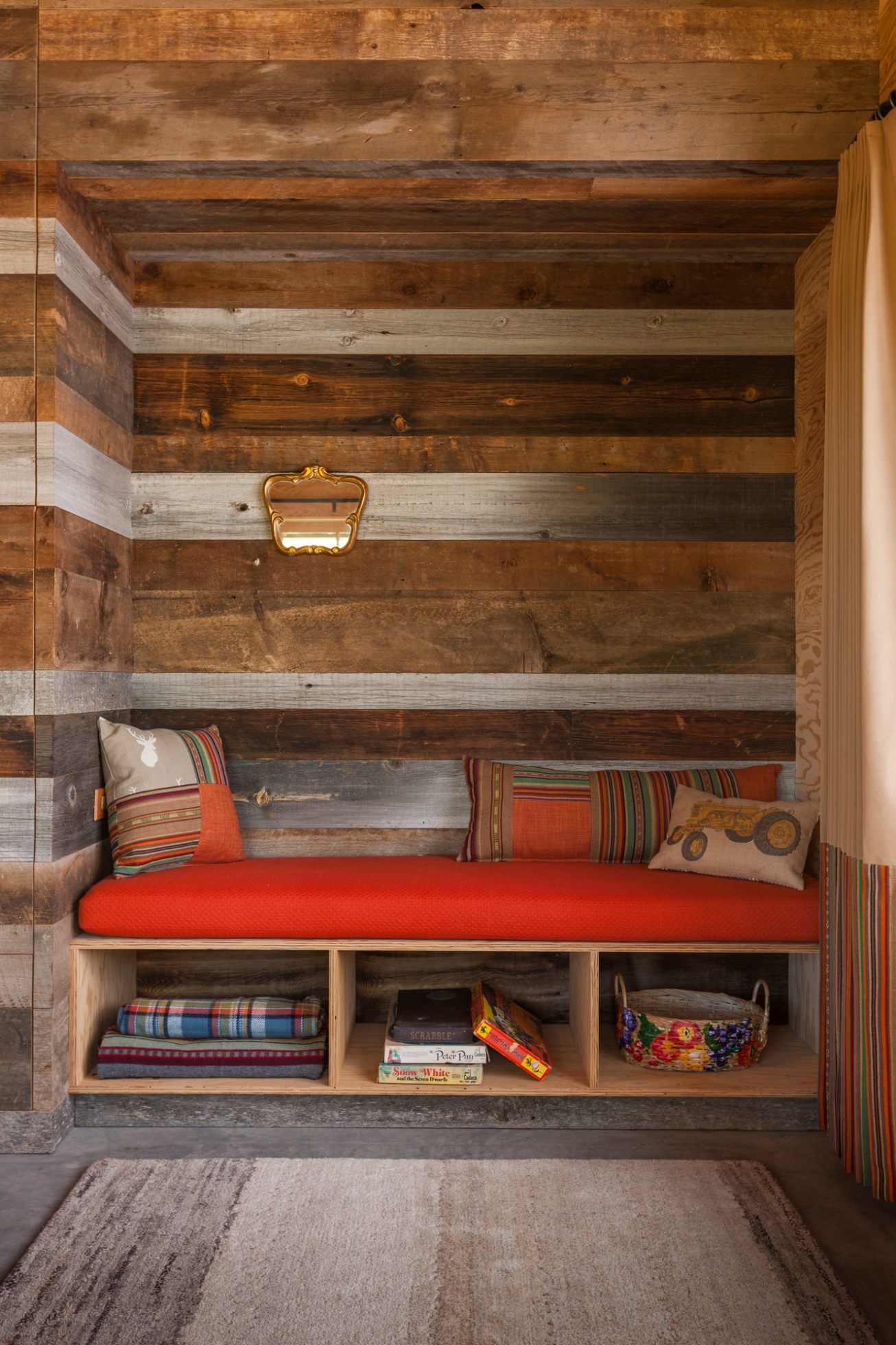 An eclectic cabin aesthetic includes reclaimed wood from the property’s 1890s barn.