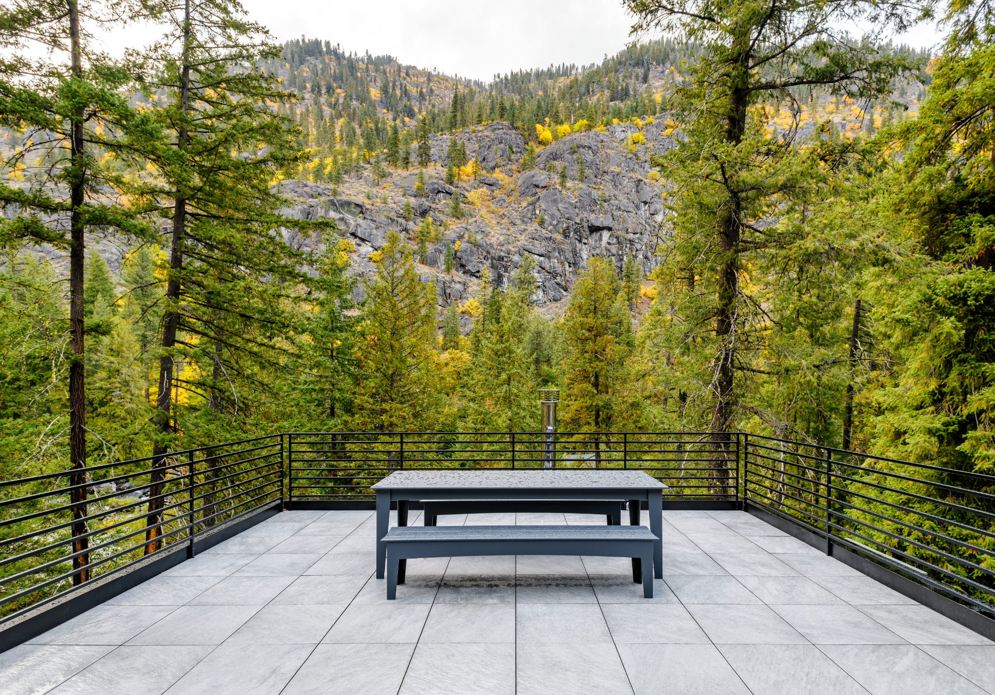 A roof deck expands the living space of the roughly 1,000-square-feet cabin.