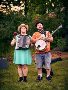 Luz and Francis perform at a neighborhood yard party.
