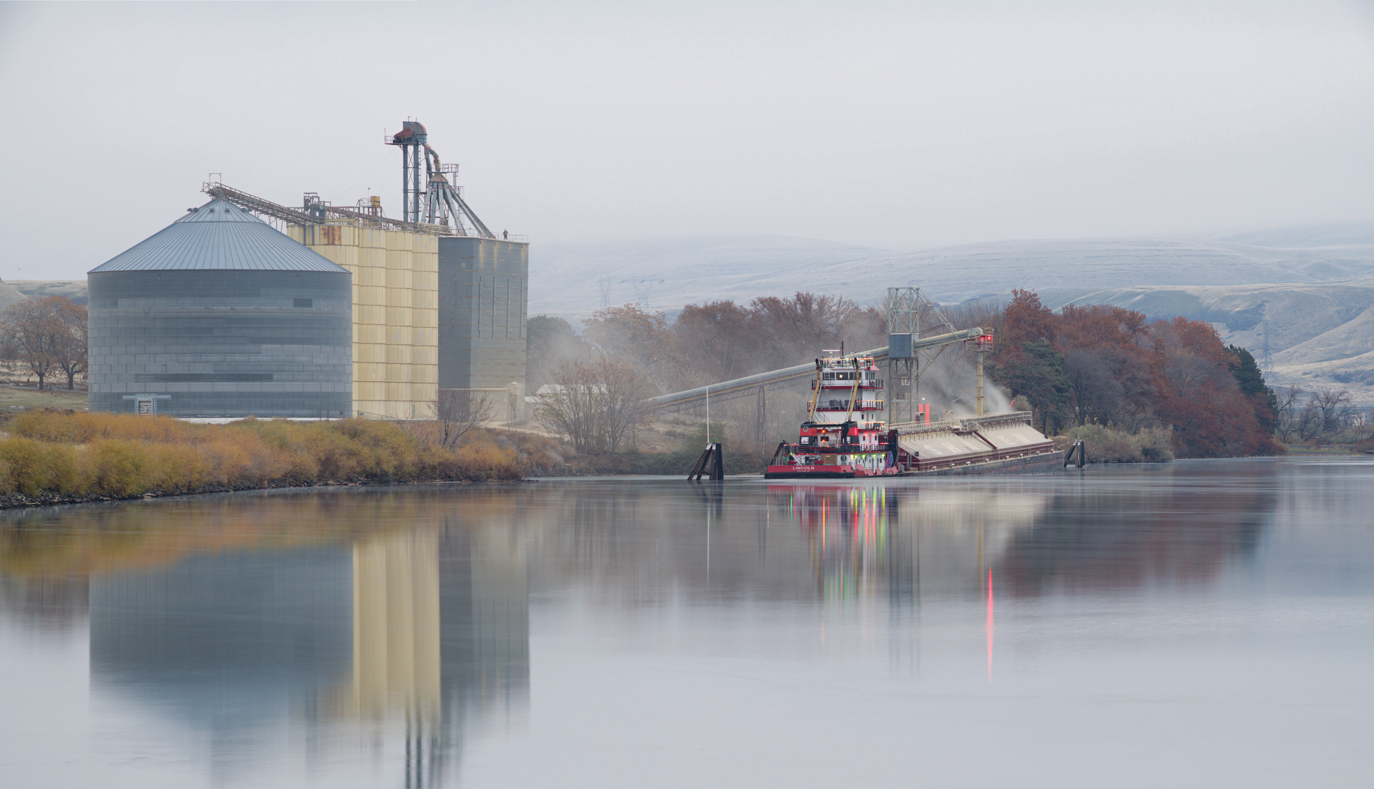 With Lewiston, Idaho, as the world’s most inland seaport, barges load wheat for export at various elevators along the lower Snake River.